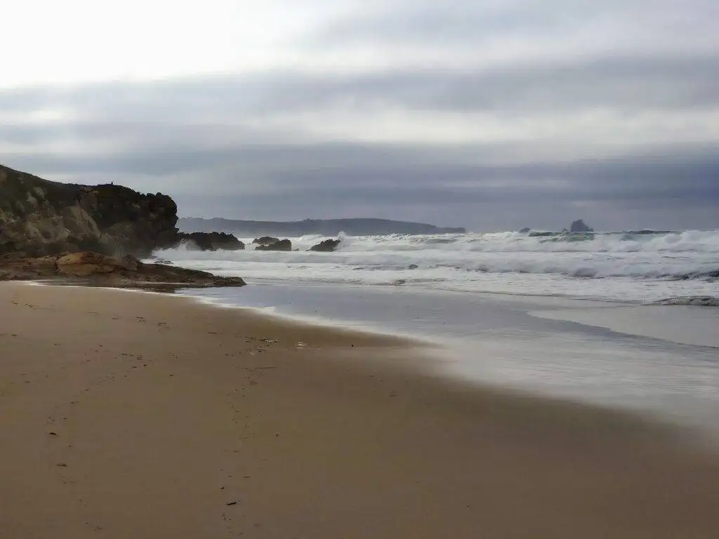 Liencres beach gold sand cloudy sky