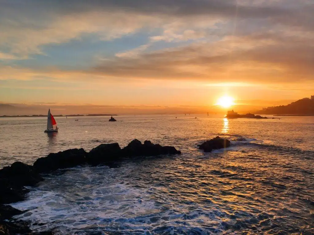 sunset view santander bay rocks and ship 1 day in cantabria santander HiCantabria la magdalena itinerary itinerario